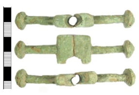 Cast cu-alloy bar from a now incomplete cast copper-alloy post-medieval purse, dating from the early 16th century.