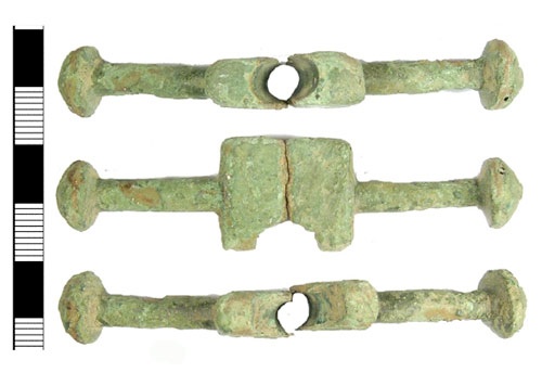 Cast cu-alloy bar from a now incomplete cast copper-alloy post-medieval purse, dating from the early 16th century.